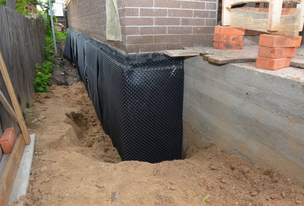 Happy homeowners after waterproofing job in Fountain